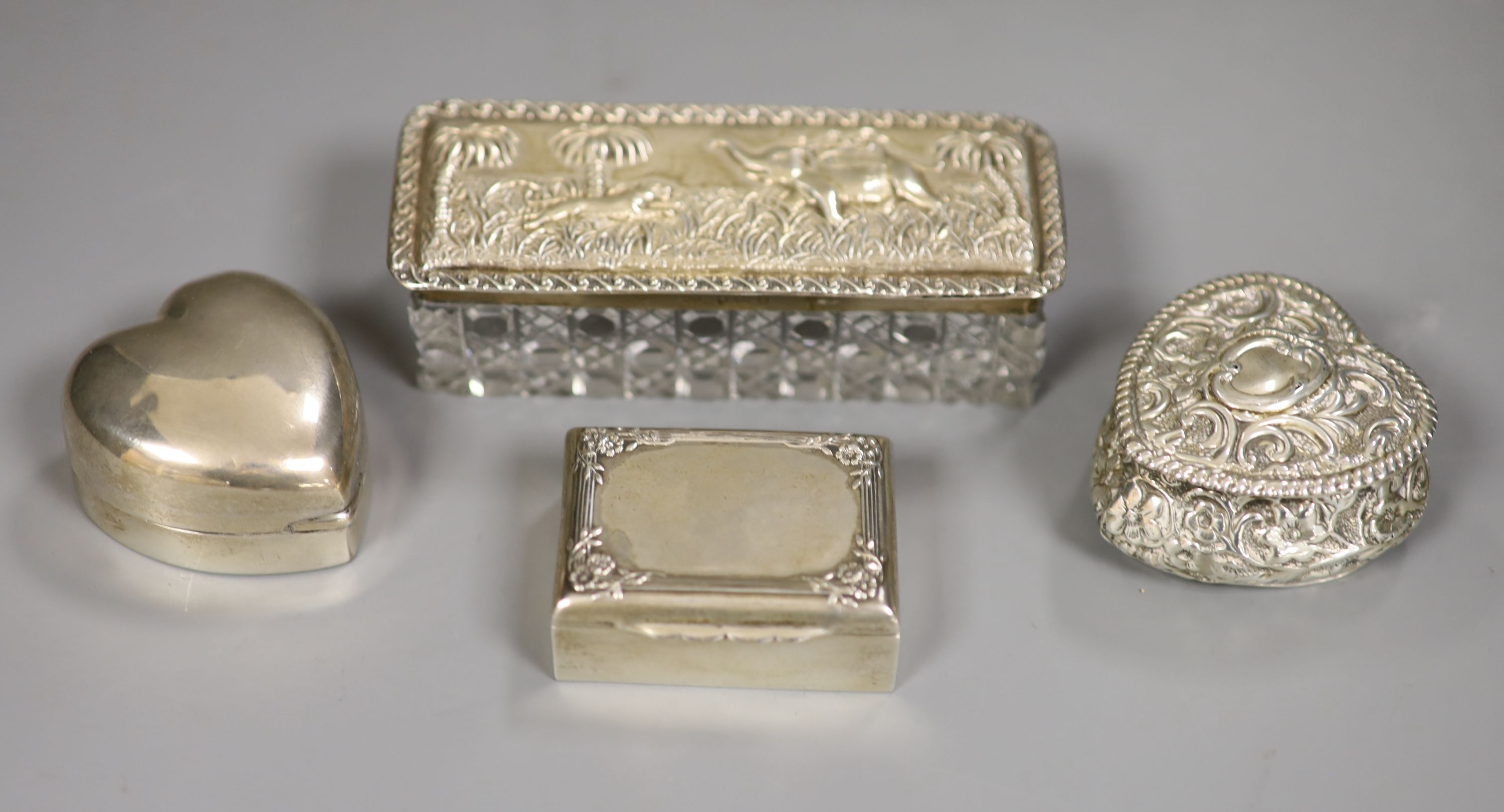Two Victorian/Edwardian silver heart shaped pill boxes (one with holes), a rectangular snuff box and a toilet box.
